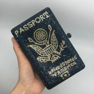 Dark blue passport shaped rhinestone evening clutch bag with sparkling golden eagle emblem