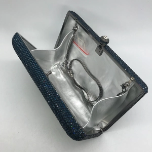 Navy blue rhinestone passport clutch bag with chain strap and shiny silver lining