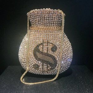 Sparkling money bag clutch with dollar sign crystals and a gold metal chain strap