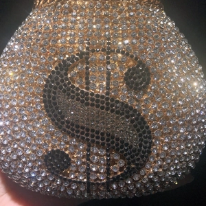 Luxurious money bag evening clutch with sparkling crystals and dollar sign pattern