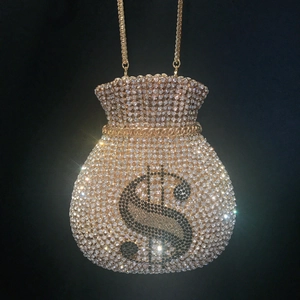 Golden money bag clutch bag encrusted with sparkling crystals and dollar sign