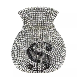 Macro shot of luxury money pouch clutch bag featuring crystal rhinestones and dollar sign