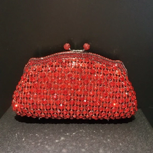 Luxurious red rhinestone evening clutch bag with sparkling crystals and metal clasp
