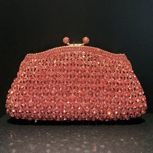 Exquisite hollow out evening clutch bag with pink crystals and gold metal clasp