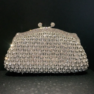Elegant silver metal clutch bag with sparkling crystals and luxury rhinestone buckles