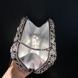 Luxurious hollow evening clutch bag with sparkling crystals and silver metal chain strap