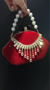 Elegant red velvet shell-shaped evening bag with crystal tassels and pearl strap