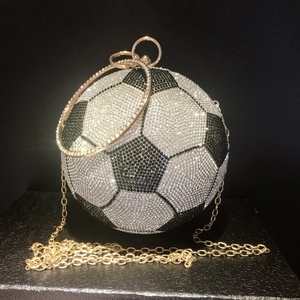Spherical soccer clutch bag covered in sparkling black and white crystals with chain