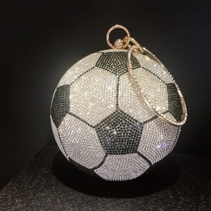 Sparkling soccer ball evening clutch bag with black and white rhinestones and gold ring handle