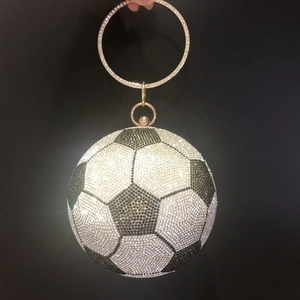 Detailed view of soccer ball evening bag with sparkling black and white rhinestones