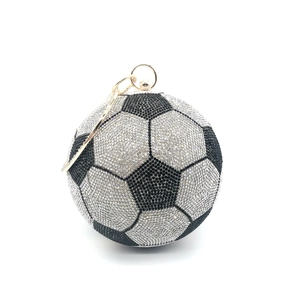 Detailed view of soccer ball evening bag with black and silver crystal rhinestones