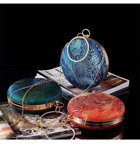 Three peacock embroidery round evening bags in blue, green and red with gold metal handles