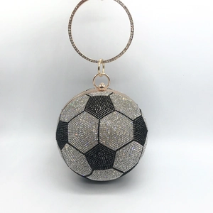 Detailed close-up of soccer ball evening bag featuring black and white sparkling rhinestones