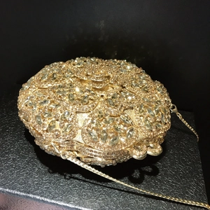 Elegant champagne gold round crystal evening clutch bag with sparkling diamond-set flowers