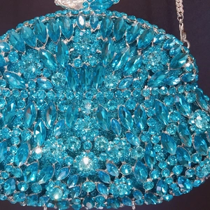 Elegant turquoise rhinestone evening clutch bag with sparkling crystals and silver chain strap