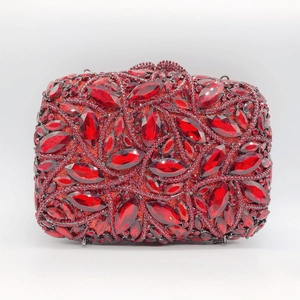 Close-up of red marquise crystal clutch purse featuring sparkling rhinestone textures