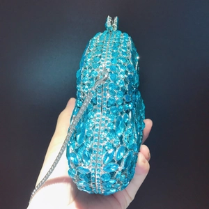 Detail of the blue crystal evening clutch bag with sparkling rhinestones and silver chain