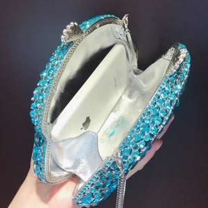 Blue rhinestone clutch bag interior showing silver lining and space for a smartphone