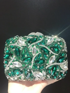 Luxurious emerald and crystal evening clutch bag with intricate vine rhinestone pattern