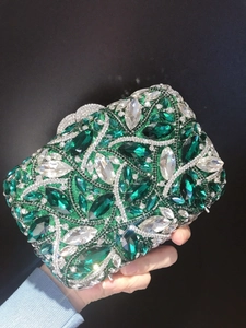 Luxury emerald and clear crystal evening clutch bag with sparkling rhinestone wave design