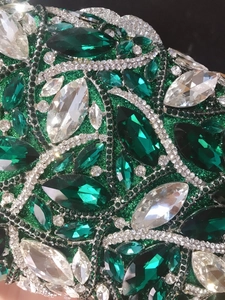 Detail of emerald green crystal clutch with marquise cut stones and rhinestone patterns