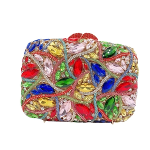 Luxurious evening clutch with colorful rhinestones in floral patterns and gold clasp