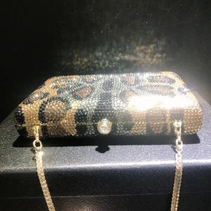 Luxury leopard print rhinestone evening clutch bag with gold chain strap on black box