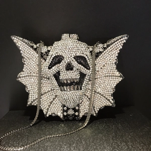 Sparkling silver rhinestone bat skull evening bag with a metal chain strap for women