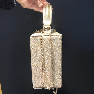 Chic gold sequin hard shell evening clutch bag with metal handle and chain strap