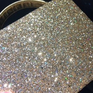 Sparkling champagne gold sequin handbag with elegant round metallic handles for evening events