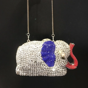 Macro detail of elephant evening bag with sparkling silver and blue crystal embellishments