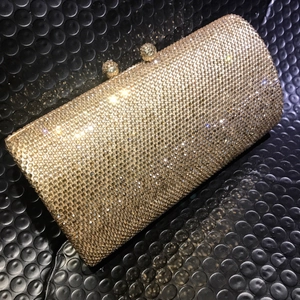 Luxurious champagne gold rhinestone evening clutch bag with sparkling diamond ball clasps