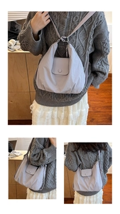Detail of lavender pleated tote bag with flap pocket and adjustable shoulder strap
