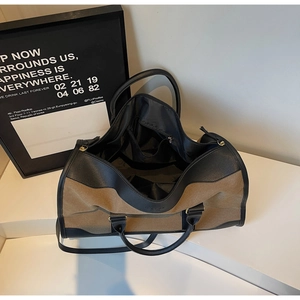 Top view of large canvas tote bag showing spacious interior with zipper pockets and lining