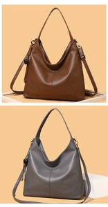Detail of hobo bag with pebble leather texture, heart charm and adjustable straps