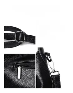 Close-up of durable gunmetal hardware and litchi texture leather on black handbag