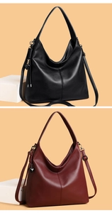 Close-up of hobo bags in black and wine red lychee leather with heart charms