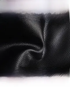 Close-up of black lychee grain faux leather showing waterproof and wear-resistant texture