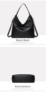 Detail view of the black lychee pattern leather handbag showing back zipper and wide bottom