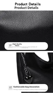 Detail of black lychee grain leather handbag with a heart-shaped metal charm
