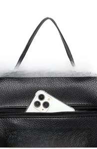 Detail view of black lychee grain tote with rear zipper pocket and phone storage