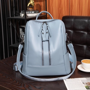 Minimalist soft leather backpack for women in light blue with double zippers and top handle