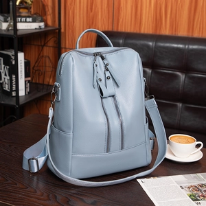 Light blue faux leather backpack for women with dual zippers and pebble grain texture