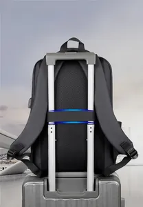 Business backpack with luggage strap and breathable mesh back panel on suitcase