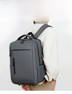 Dark gray business backpack featuring multiple functional pockets and a sturdy handle