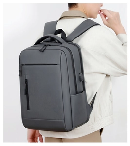 Detail view of large capacity dark grey business backpack with external USB charging port