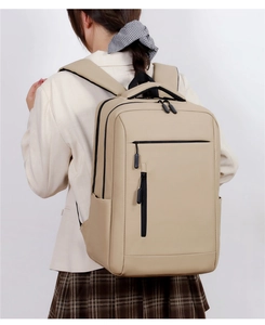 Detail of beige business backpack with padded straps and water-resistant fabric