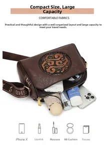 Internal view of brown vintage embossed leather crossbody bag showing large storage capacity
