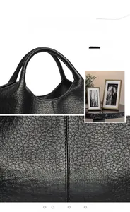 Close-up of black litchi grain leather bag with water-repellent and durable texture