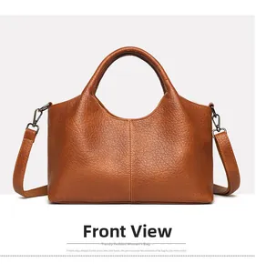 Front view of caramel lychee grain leather handbag with adjustable crossbody strap